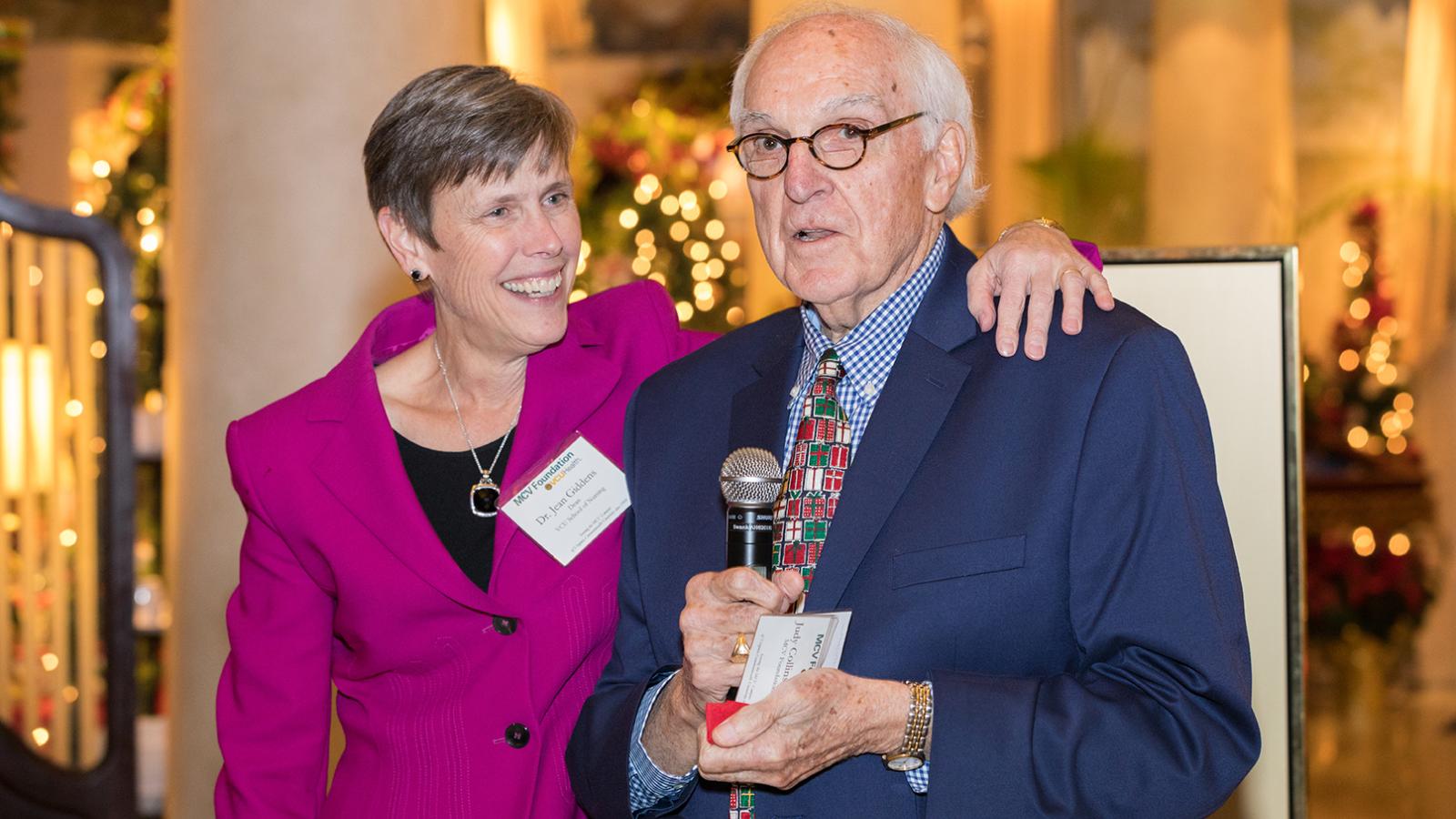 Dean Giddens with MCV Foundation board member Joe Teefey as he announces an impromtu fundraising challenge to benefit the Clinical Scholars Program at the foundation’s December board meeting reception.